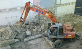 Pelle hydraulique sur pneus Hitachi ZX 135 W